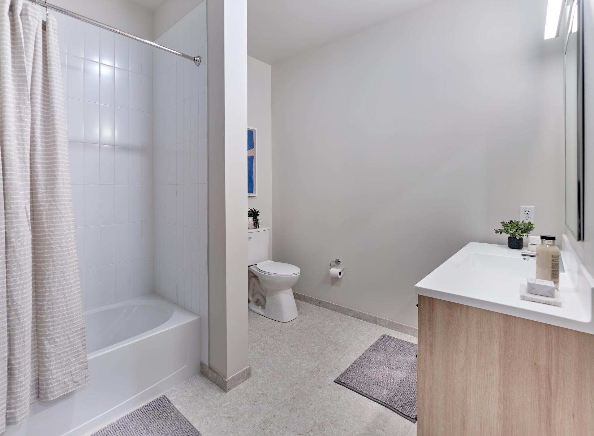 The Winston apartment bathroom with premium tile - New Haven, CT
